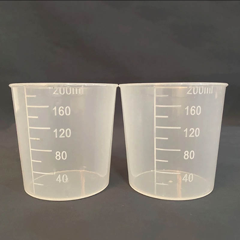 プラスチック製の測定カップモールディング
